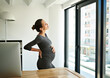 © peopleimages.com - Professional, pregnant woman and maternity back pain of stress with stomach discomfort, burnout and risk. Business, emergency or exhausted with bloating, uncomfortable ache or overworked at workplace