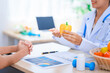 © Phushutter - Female Asian nutritionist providing consultations for weight loss. reduce belly fat, offering advice on nutrients, metabolism, hydration, balanced diets to improve overall health and wellness.