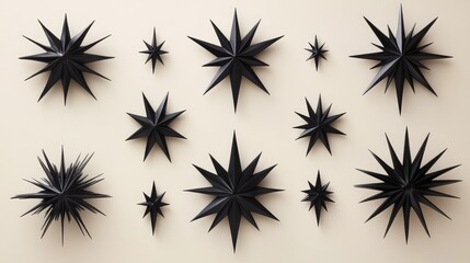 Poster - A Collection of Abstract Black Star Decorations Displayed on a Light Background, Showcasing Various Sizes and Shapes for Modern Interior Design Inspiration
