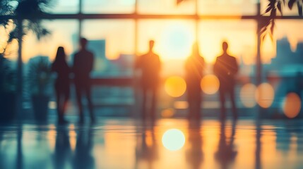 Aufkleber - Silhouetted business people watch sunset from modern office building