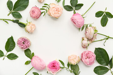 Wall Mural - Frame made of beautiful pink roses with leaves on white background