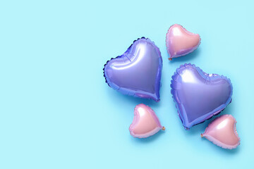 Wall Mural - Heart shaped air balloons on blue background. Valentine's day celebration