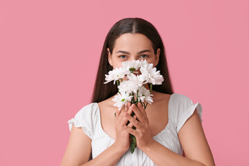 Sticker - Beautiful young woman with daisy flowers on pink background