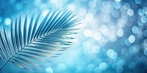 Poster - A single palm frond extends into a blue bokeh background, creating a serene and tranquil atmosphere.