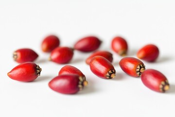 Poster - A cluster of bright red berries sits atop a clean white surface, perfect for adding a pop of color to any design