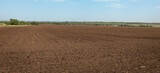 panoramic view of a agricultural plowed field background,  rural landscape
