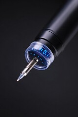 Poster - A close-up shot of a pen featuring a clock face on the side