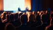 Audience attending presentation in conference hall with speakers on stage. Business event, networking opportunities, and knowledge sharing in professional setting.