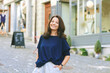 © annanahabed - Outdoor portrait of happy mature woman posing on the street, urban lifestyle
