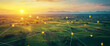 © PhotoArtHub - Aerial view of farmland at sunset with digital connections represented by glowing location markers, symbolizing modern connectivity in agriculture and technology.