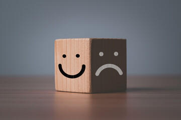Poster - Smile face on bright of block and sad dace on dark of block for mental health and emotional mindset concept