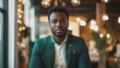 © Tobi - A confident Black entrepreneur in a stylish green blazer presenting a project in a well-lit office with a festive atmosphere