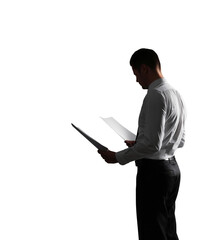 Poster - Silhouette of a man in formal attire holding documents in both hands, isolated on a white background. Concept of business, professionalism