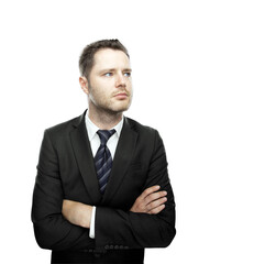 Poster - Man in formal business attire with a thoughtful expression, crossing arms, standing against a clean white background. Professional portrait concept