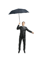 Poster - A businessman in a suit holding an umbrella, appearing to float in mid-air. Isolated on a white background. Concept of creativity and imagination