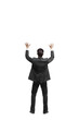 © peshkova - Man in a suit seen from behind, raising arms in celebration or surrender, isolated on a white background. Concept of success or gesture