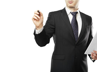 Poster - Man in formal business attire holding a pen and paper, writing in the air. Isolated on white background. Concept of business, planning, or presentation