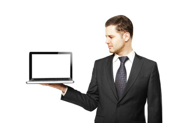 Poster - Businessman in suit holding a laptop with a blank white screen. Isolated on a clean white background. Concept for design, mockup, or app display