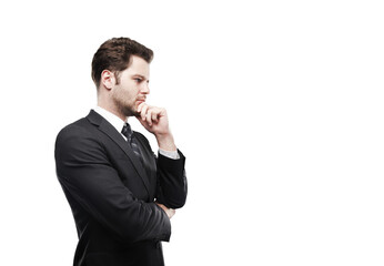 Poster - Side view of a businessman in a suit, deep in thought, with a hand on his chin, isolated on a white background. Professional concept