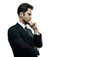 Poster - A man in a formalsuit and tie, holding his chin in a thinking pose. Isolated on a clean white background. Concept of decision-making