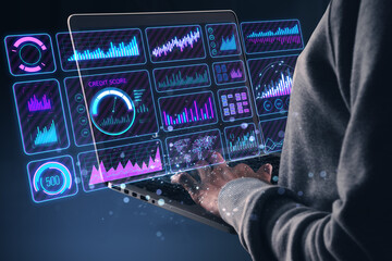 Leinwandbilder - Person interacting with digital financial graphs and charts on a laptop screen.