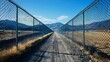 © Linus - A long road with a chain link fence on either side