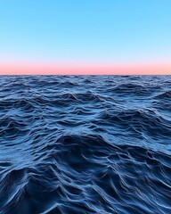 Wall Mural - vast blue ocean waves under a clear sky, capturing the tranquil beauty of nature and the horizon at 