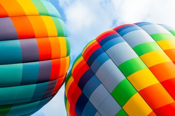 Wall Mural - Colorful hot air balloons against the blue sky with white clouds