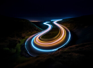 Leinwandbilder - Serpentine road curves through a dark landscape at night.  Light trails from vehicles create vibrant streaks of blue and orange against the black.  The scene is dramatic and evokes a sense of movement