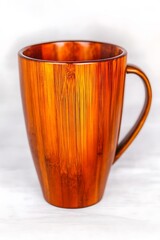 Canvas Print - Elegant wooden mug on a soft background, showcasing craftsmanship and design