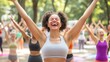 © warunthorn - Joyful woman celebrating fitness in outdoor yoga class with friends