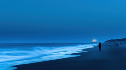 Wall Mural - Serene Night Beach Scene with Solitary Figure and Lighthouse Glow