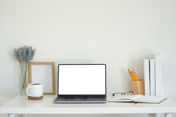 Poster - Laptop with a blank white screen, a white coffee mug on a coaster, an open notebook, and glasses.
