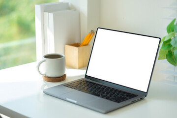 Fototapete - Modern desk with a laptop, coffee mug and pencils neatly arranged, creating an inviting and productive workspace.