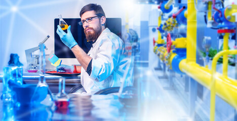 Poster - Man industrial laboratory assistant. Scientist with flask near microscope. Quality control produced gasoline. Industrial pipes behind scientist. Man laboratory assistant sitting at desk with monitor