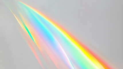 Fototapete - A stunning colorful light spectrum, resembling a rainbow, gracefully arching across a plain light gray background. The vivid colors transition smoothly from red to violet, creating a soft, ethereal, a