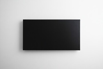 Poster - Blank black canvas framed beautifully against a white wall creating a striking modern aesthetic for minimalist decor