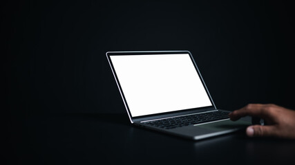 Poster - Workspace dark background new project on laptop computer with blank copy space screen for your advertising text message, Laptop with blank screen and placed on a black table.