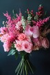 © anatolii - Beautiful floral bouquet featuring pink roses, orchids, and delicate greenery arranged for a special occasion
