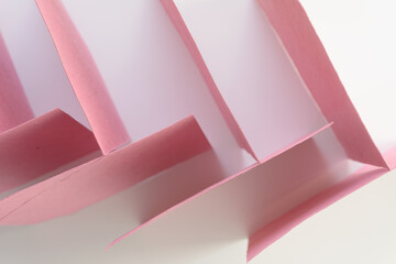 Poster - top down view of standing pink cards on blank paper