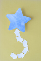 Wall Mural - white arrows and blue star on yellow