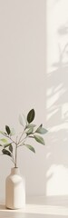 Poster - Elegant display of a single leafy plant in a neutral vase, creating an airy atmosphere in a minimalist setting