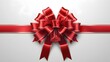 © Asim - A luxurious, vibrant red satin ribbon elegantly wraps around itself, forming a perfect bow, set against a pristine white background, evoking a sense of sophistication and festivity.