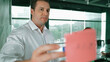 © Summit Art Creations - Skilled businessman presents marketing idea to project manager by using colorful sticky notes at glass wall. Project manager pointing, explaining, showing start up project to investor. Manipulator.