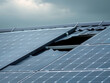 © Nakarin - Damaged solar panels on roof under evaluation after storm