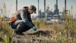 © LorelEino - An environmental scientist collecting soil samples in a polluted area, with industrial facilities and testing equipment in the background, Field study scene