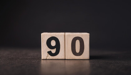 Fototapete - Wooden cube with number 90. Modern design. Dark backdrop.