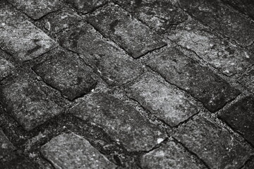 Poster - A classic black and white image of a brick sidewalk, great for use in historical or vintage-themed projects.