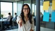© Kubista - Smiling Businesswoman Offering Handshake in Modern Office