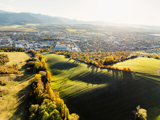 Wall Mural - Sunset over Liptov region with High Tatras mountains around. Liptovsky Mikulas landscape, Slovakia.